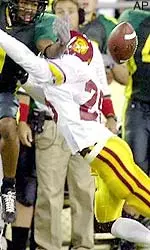 USC defender Chris Cash breaks up a pass intended for an Oregon receiver.
