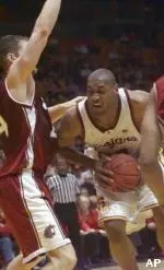 USC's Sam Clancy takes the ball into the Cougar defense during Friday's victory over WSU.