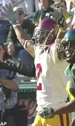 Kareem Kelly celebrates after scoring in the Trojans' 44-33 win.