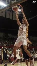 Southern California's Rory O'Neil hangs from the rim as he dunks against UC Riverside.