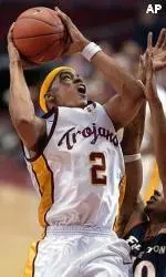 Nick Curtis goes up for a shot as Cal State-Fullerton's Bron Groomes defends during the second half.