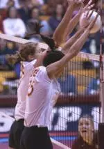 USC's Emily Adams and Lauren Killian block a Texas A&M attack in the Trojans' 3-0 victory on Saturday.