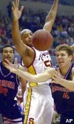 Sam Clancy defends against Arizona's Luke Walton Saturday.
