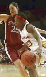 Aisha Hollans drives to the basket as Stanford's Lindsey Yamasaki guards.