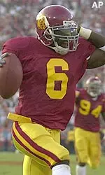 Antuan Simmons jogs into the end zone for a touchdown after intercepting a UCLA pass in the first half Saturday.