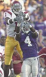 USC's Mike Williams goes up for the pass as KSU's Terence Newman defends.