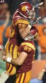 Justin Fargas (left) celebrates after scoring one of his two touchdowns for the Trojans.