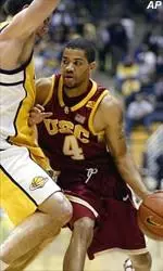 Robert Hutchinson tries to get past a Cal defender during the Trojans' 73-68 loss.