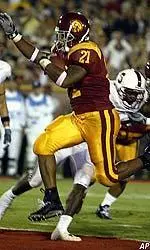 Lendale White jumps into the end zone scoring their second touchdown against Stanford during the first half.