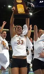 Southern California players celebrate with their NCAA Division I championship trophy after defeating Florida.