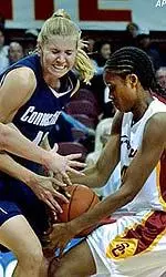 Jamie Funn tries to grab the ball from a UConn player during the first half.