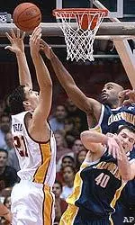 USC's Rory O'Neil goes up for a shot against Cal, Saturday.