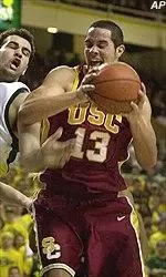 Gregg Guenther fights for position during the Trojans' loss in Eugene on Thursday.