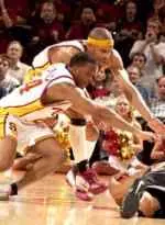 Derrick Craven and Desmon Farmer scramble for a loose ball.
