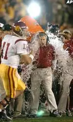 USC head coach Pete Carroll gets doused by his team in the final moments of their 28-14 victory over Michigan.