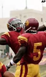 Dwayne Jarrett, left, congratulates Reggie Bush after he scored a touchdown against Arizona State during the first quarter.