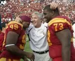 USC--led by head coach Pete Carroll, here celebrating with Mike Patterson and John Drake after last week's Arizona State victory--tops the intial BCS standings.
