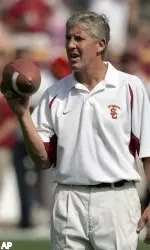 Coach Pete Carroll watches his team warm up before their game against California.