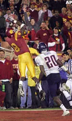 USC's Dwayne Jarrett makes a touchdown catch as Arizona's Lamon Means defends during the second half. (AP Photo/Mark J. Terrill)