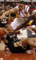Western Michigan's Jeff Bronson, on floor, is pressured by USC's Nick Curtis, top, and Lodrick Stewart, right.. (AP Photo/Phil McCarten)