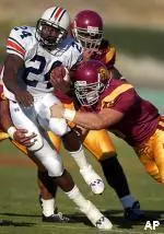Matt Grootegoed made the 2004 AFCA All-American first team along with teammates Matt Leinart and Reggie Bush.