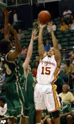 Alabama-Birmingham's Demario Eddins attempts to block a shot by Dwayne Shackleford. (AP Photo/Lucy Pemoni)