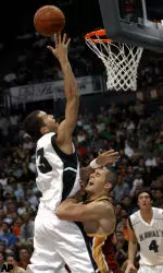 Hawaii's Bobby Nash shoots over Greg Guenther. (AP Photo/Lucy Pemoni)