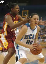 USC's Eshaya Murphy (14) pressures UCLA's Ortal Oren (00) in the first half in Los Angeles, Tuesday, Dec. 28, 2004. (AP Photo/Phil McCarten)