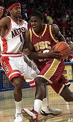 Rodrick Stewart drives to the basket against an Arizona defender during the first half.