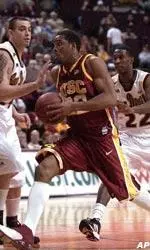 Southern California guard Errick Craven, center, drives to the basket against Arizona State defenders Jamal Hill, right, and Chris Low during the first half.