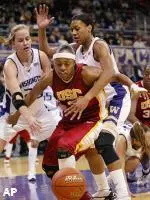 Washington's Maggie O'Hara, left, and Jill Bell, right, pressure USC's Rometra Craig, center, during the first half.
