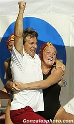 USC head coach Jovan Vavic and junior Erin Wilson enjoy the celebratory "dip in the pool" after the Women of Troy won the 2004 NCAA Women's Water Polo Championship