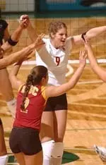 Emily Adams (9), Debora Seilhamer (2) and the Women of Troy celebrate a point against Georgia Tech.