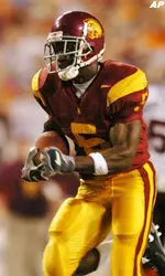 USC running back Reggie Bush leaves the Virginia Tech defense in the dust as he runs for his touchdown during the first quarter, Saturday.
