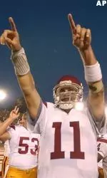Matt Leinart gives the number one sign after USC defeated Stanford 31-28. USC is ranked number one in the country.