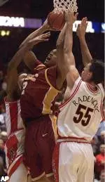 Nick Curtis (2) goes for a shot despite the attempted blocks by Arizona's Channing Fyre left, and Ivan Radenovic (55) during the second half at McKale Center in Tucson, Ariz. on Thursday, Jan. 13, 2005. Arizona won, 77 to 68. (AP Photo/John Miller)