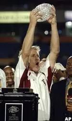 USC coach Pete Carroll holds up the trophy after defeating Oklahoma 55-19 in the Orange Bowl. (AP Photo/Chris O'Meara)