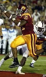 LenDale White overcame an ankle injury to rush for 118 yards and two TDs vs. Oklahoma.