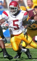 Reggie Bush Runs Through Arizona State's Jamar Williams (4) and Robert James (29) during the second quarter. (AP Photo/Paul Connros)