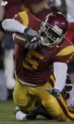Reggie Bush hits the turf after a 65-yard run against Fresno St. during the first quarter of their game in Los Angeles Saturday. (AP Photo/Kevork Djansezian)