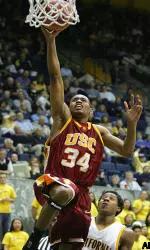 Gabriel Pruitt lays up a basket over California's Martin Smith. (AP Photo/Ben Margot)