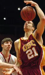 USC's Rory O'Neil loses the ball as Washington State's Robbie Cowgill grabs his arm during the first half. (AP Photo/Joe Barrentine)