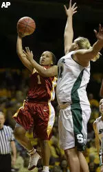 Camille LeNoir scores on a layup past Michigan State center Kelli Roehrig. (AP Photo/Andy King)