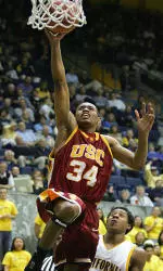 Gabe Pruitt drives to the hoop and hopes to drive the Trojans into the postseason in 2005-06