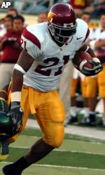 LenDale White runs past Oregon's Patrick Chung during the second quarter of USC's 45-13 win Saturday. (AP Photo/Greg Wahl-Stephens)