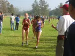 Amber Oleson at the CSUF Jammin Invitational with coach Tom Walsh timing her at the 2 mile mark