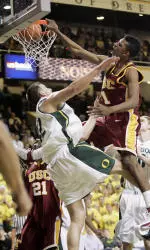 Nick Young, right, dunks over Oregon's Adam Zahn. (AP Photo/Thomas Boyd)
