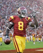 Dwayne Jarrett celebrates a first half touchdown in Saturday's win. (AP Photo)