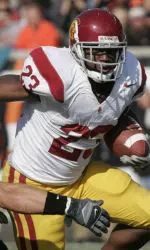 Chauncey Washington looks for room to run during the first half. (AP Photo)