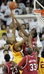 Taj Gibson, left, puts up a shot as South Carolina's Dominique Archie guards. (AP Photo)